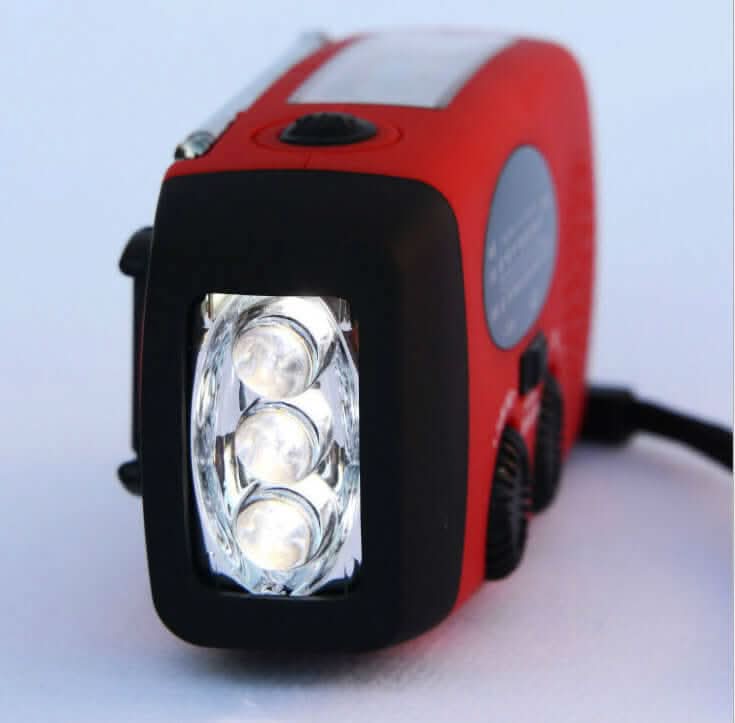 Lampe de poche radio solaire à manivelle avec chargement USB Les Visionnaires